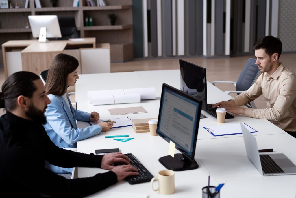 medium-shot-people-working-office